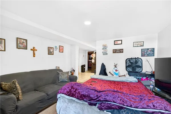 a bedroom with a bed and couch