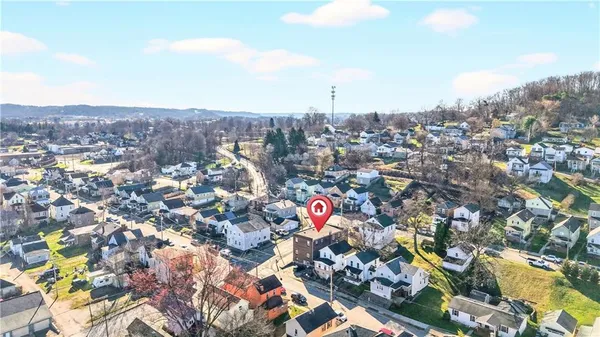 a backyard of a house with large trees