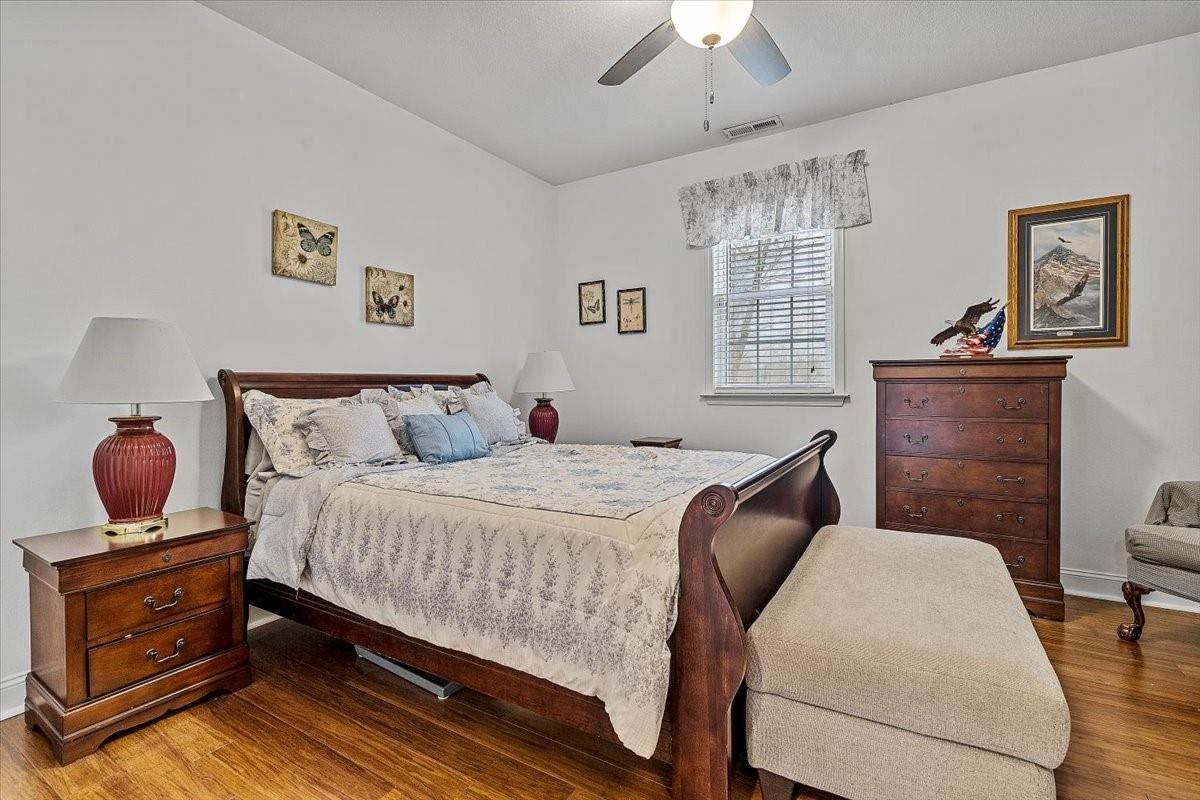 326 Point Carpenter Road Indian Land, SC 29707 - Photo 11 of 48 a bedroom with a bed and wooden floor