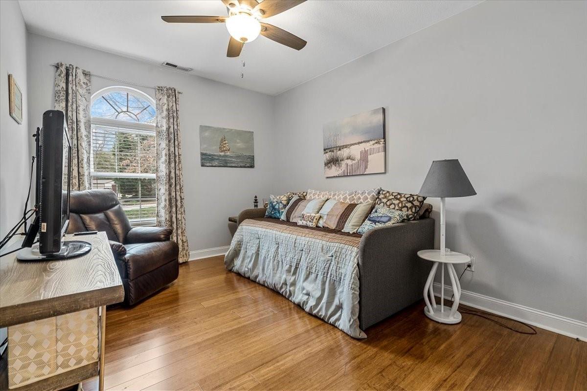 326 Point Carpenter Road Indian Land, SC 29707 - Photo 12 of 48 a bedroom with a bed and wooden floor