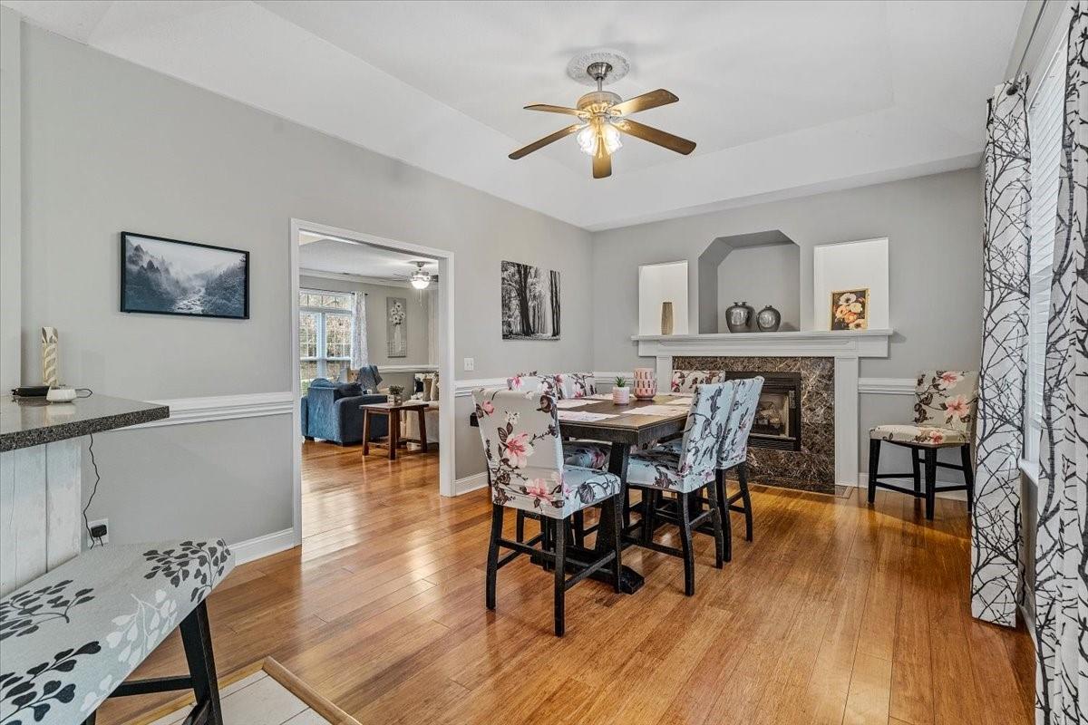 326 Point Carpenter Road Indian Land, SC 29707 - Photo 13 of 48 a view of a dining room with furniture and wooden floor