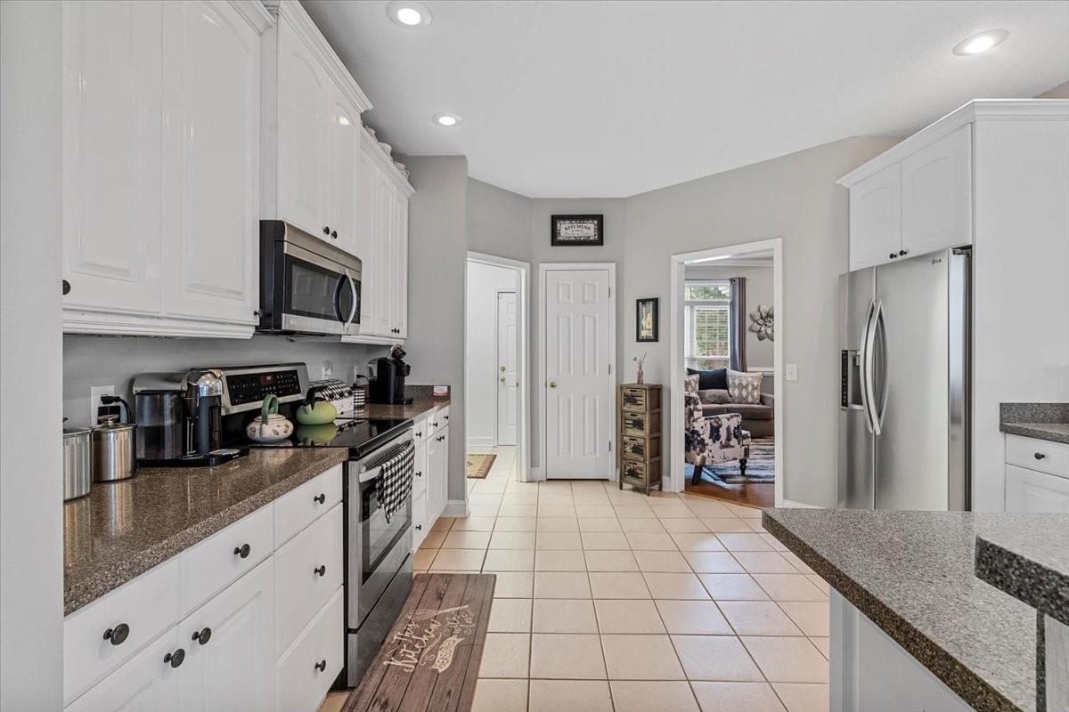 326 Point Carpenter Road Indian Land, SC 29707 - Photo 16 of 48 a kitchen with stainless steel appliances a refrigerator sink and microwave