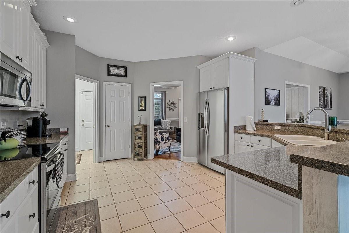 326 Point Carpenter Road Indian Land, SC 29707 - Photo 17 of 48 a kitchen with stainless steel appliances granite countertop a refrigerator and a sink