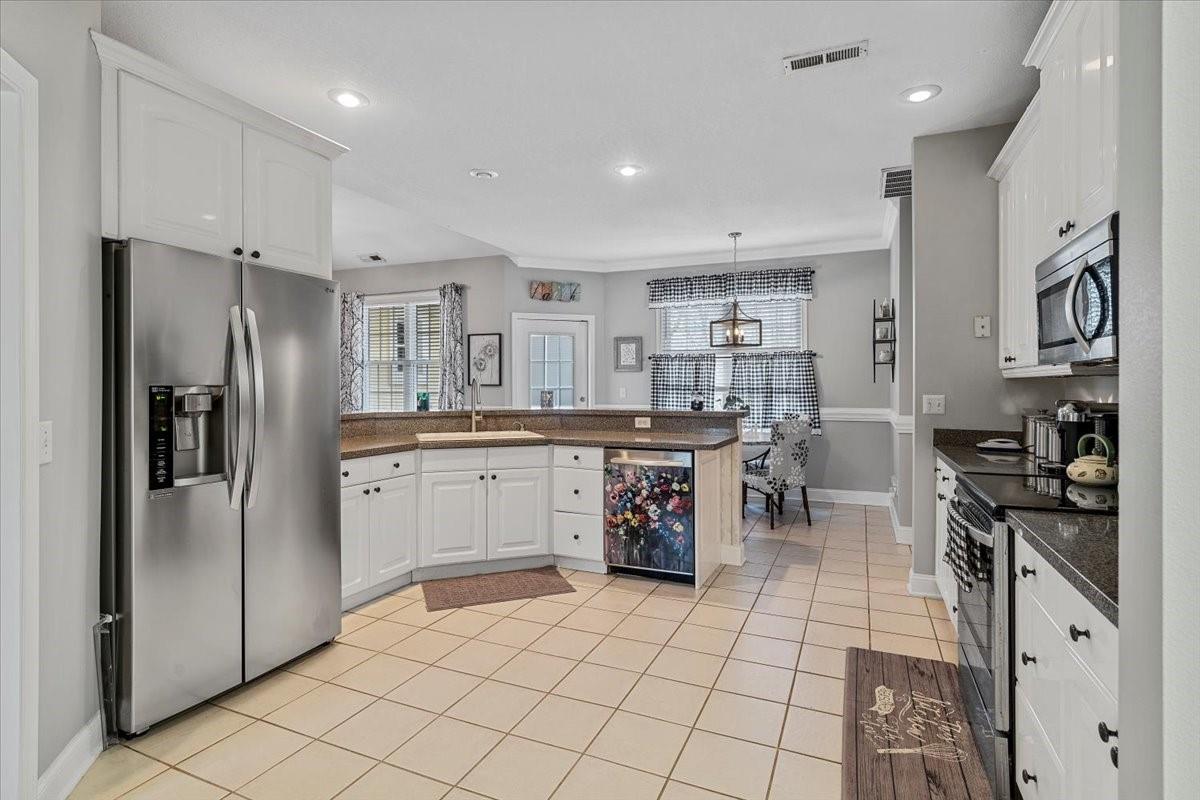 326 Point Carpenter Road Indian Land, SC 29707 - Photo 20 of 48 a kitchen with stainless steel appliances a refrigerator sink and cabinets