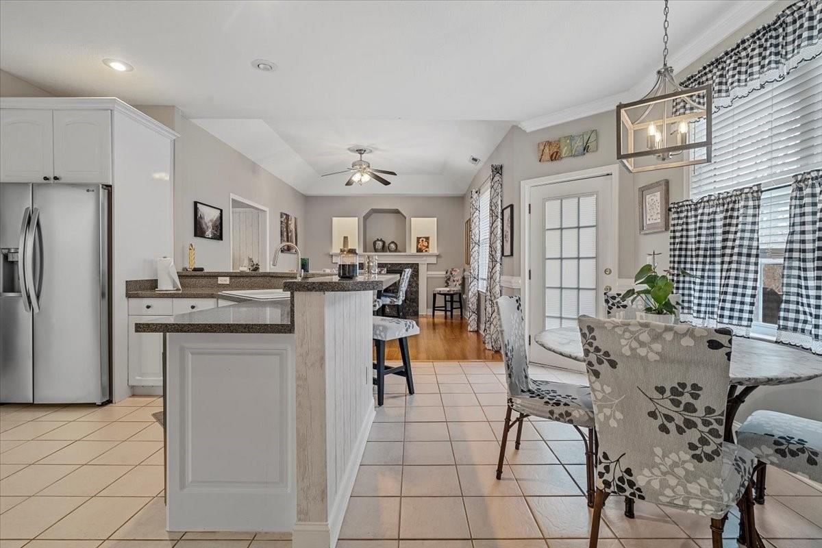 326 Point Carpenter Road Indian Land, SC 29707 - Photo 23 of 48 a kitchen with stainless steel appliances kitchen island granite countertop a refrigerator and cabinets