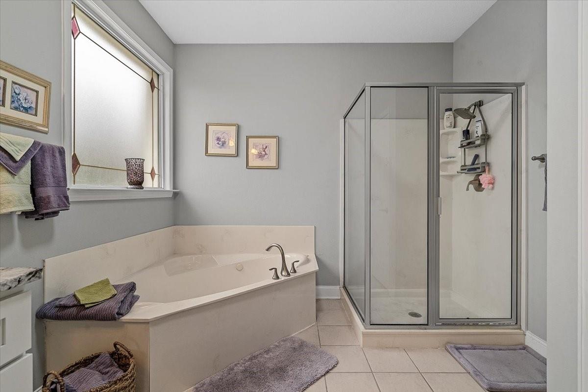 326 Point Carpenter Road Indian Land, SC 29707 - Photo 27 of 48 a bathroom with a bathtub and a shower