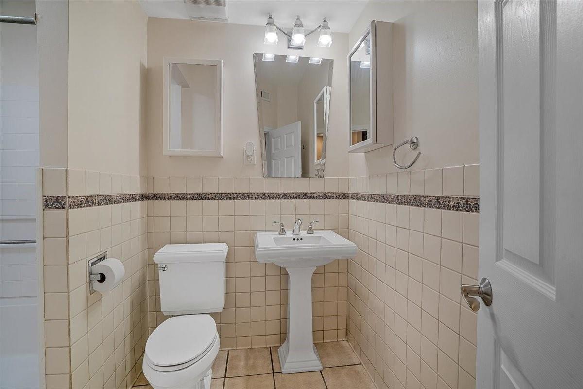 326 Point Carpenter Road Indian Land, SC 29707 - Photo 38 of 48 a bathroom with a toilet a sink and mirror