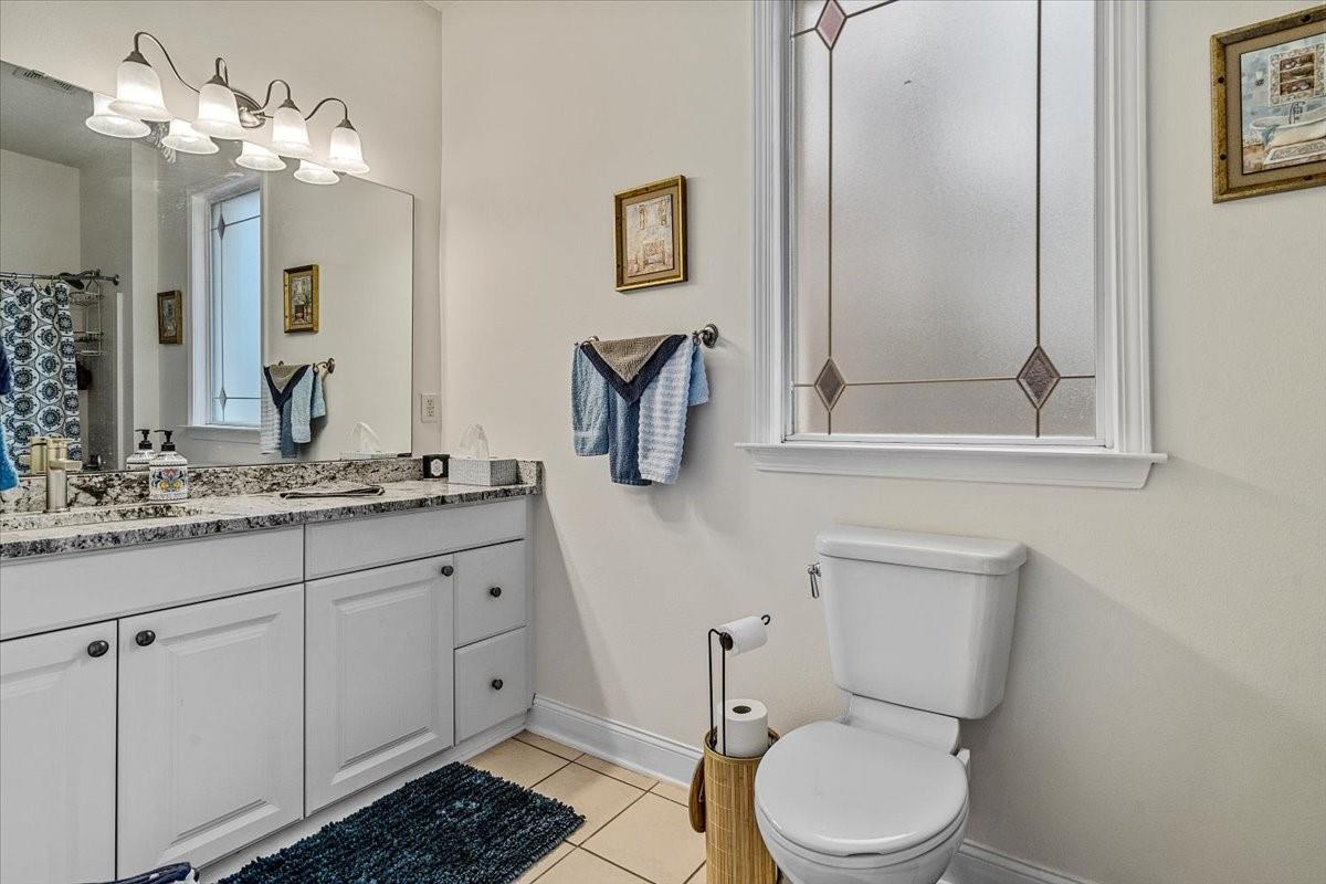 326 Point Carpenter Road Indian Land, SC 29707 - Photo 9 of 48 a bathroom with a granite countertop toilet sink and mirror