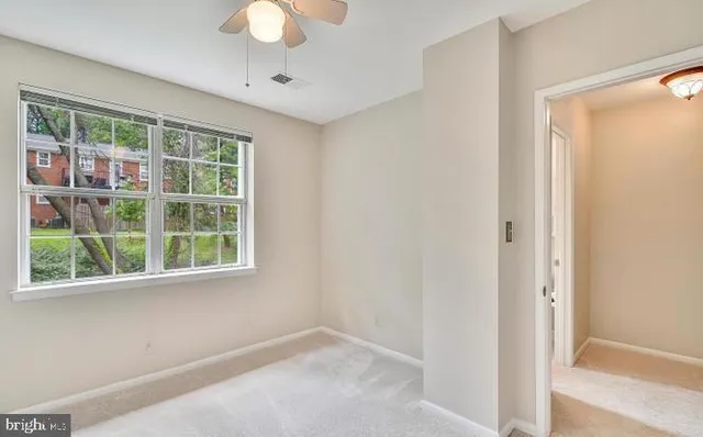 a view of an empty room with a window