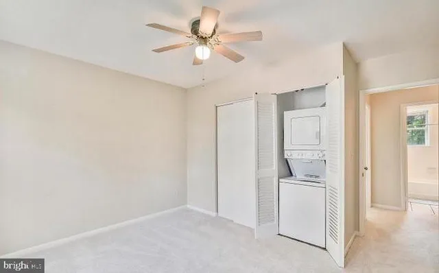 a view of a kitchen with a sink and a refrigerator