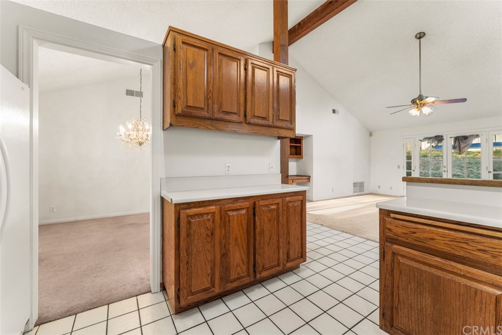1856 Gird Road Fallbrook, CA 92028 - Photo 25 of 39 a kitchen with stainless steel appliances granite countertop a refrigerator a sink and dishwasher