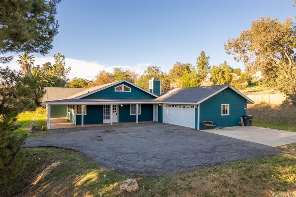 1856 Gird Road Fallbrook, CA 92028 - Photo 37 of 39 a front view of a house with a yard and large tree