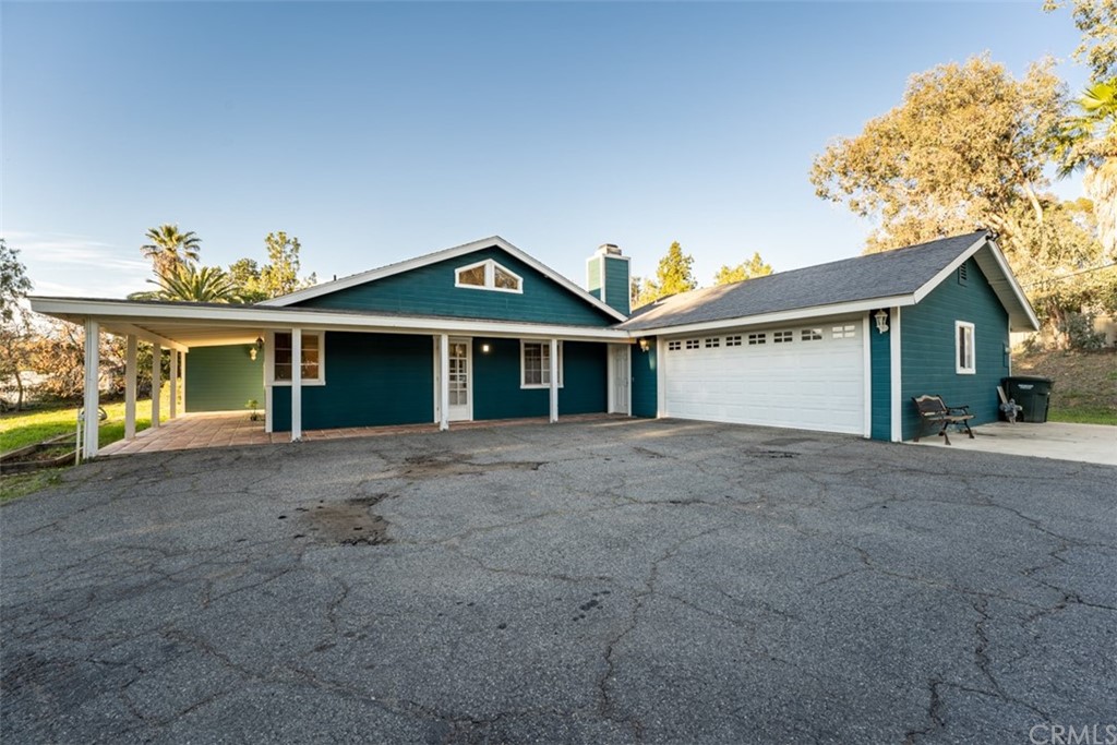 1856 Gird Road Fallbrook, CA 92028 - Photo 7 of 39 a view of a house with a yard and garage