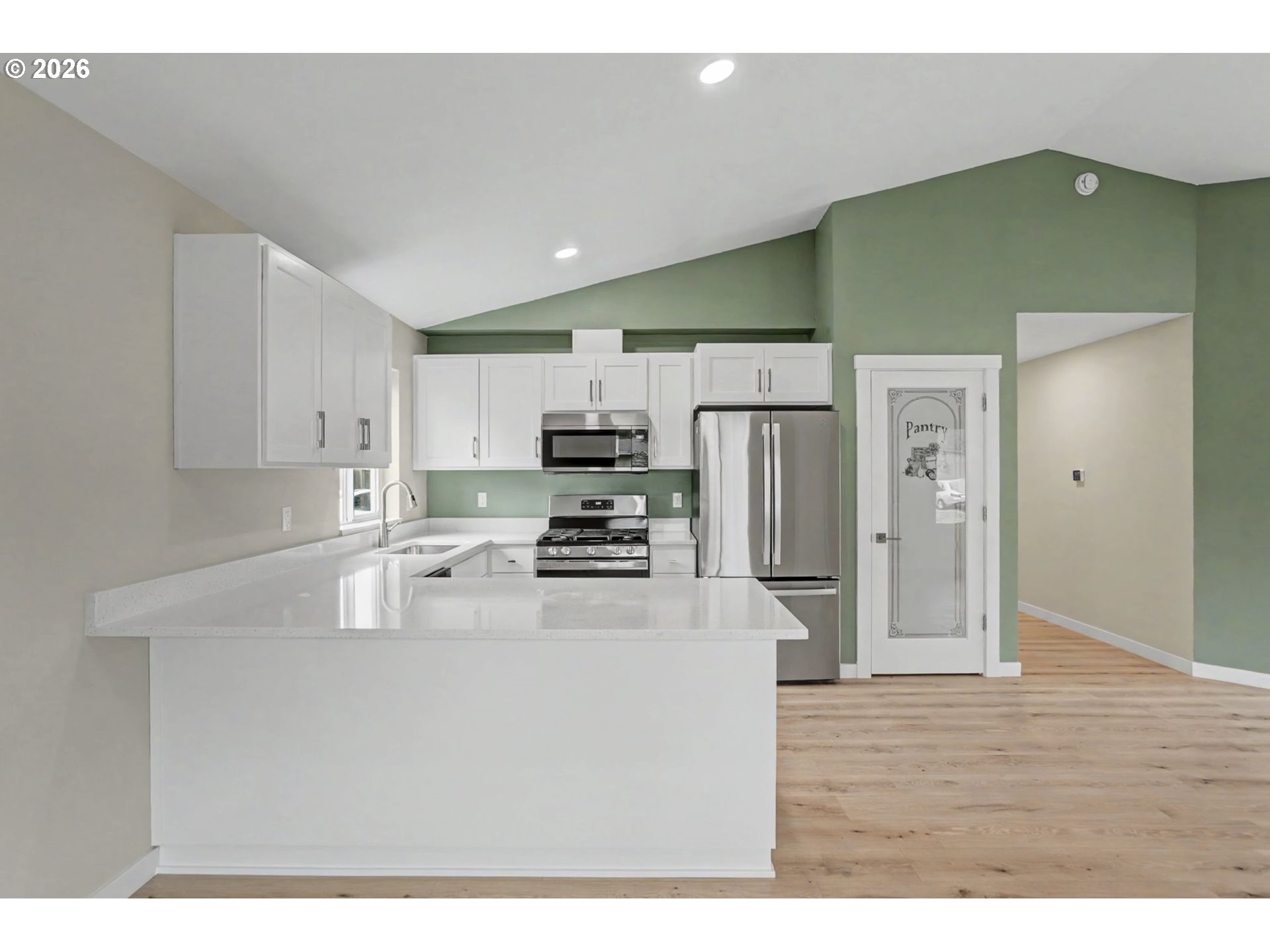 7425 5th Street Southeast Turner, OR 97392 - Photo 11 of 47 a kitchen with kitchen island a sink stainless steel appliances and cabinets
