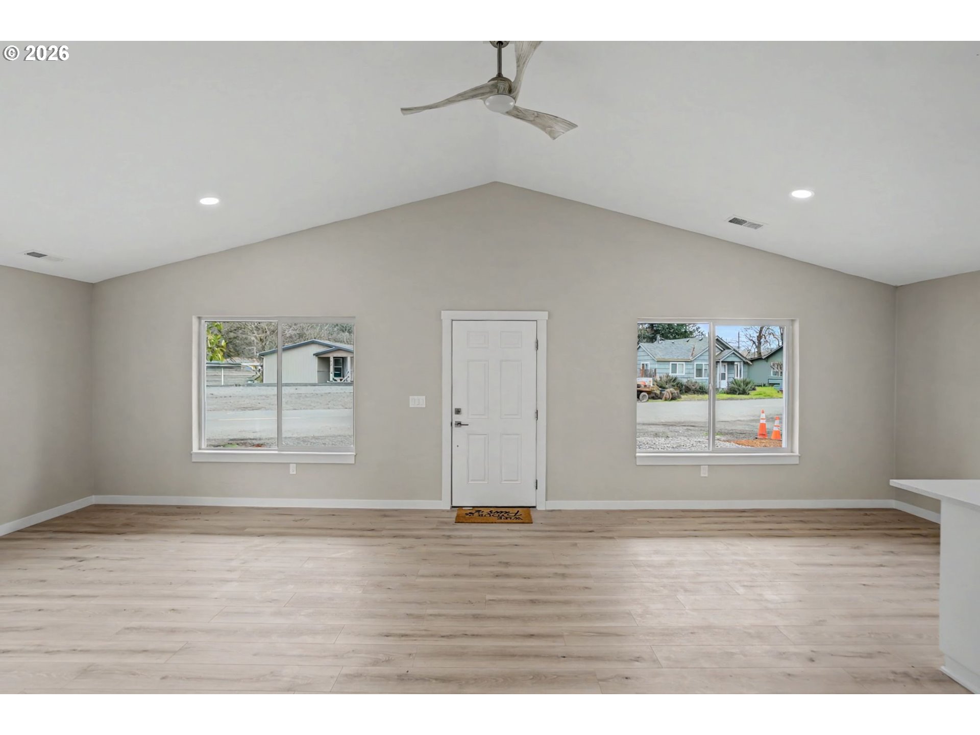 7425 5th Street Southeast Turner, OR 97392 - Photo 15 of 47 an empty room with wooden floor and windows
