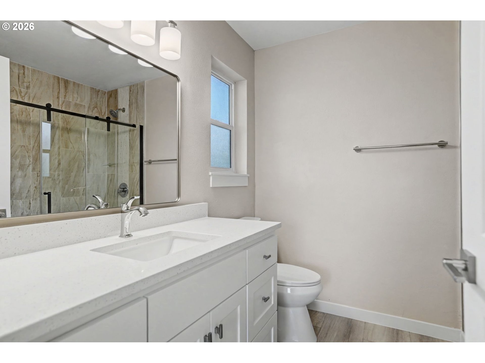 7425 5th Street Southeast Turner, OR 97392 - Photo 31 of 47 a bathroom with a sink toilet a mirror and vanity