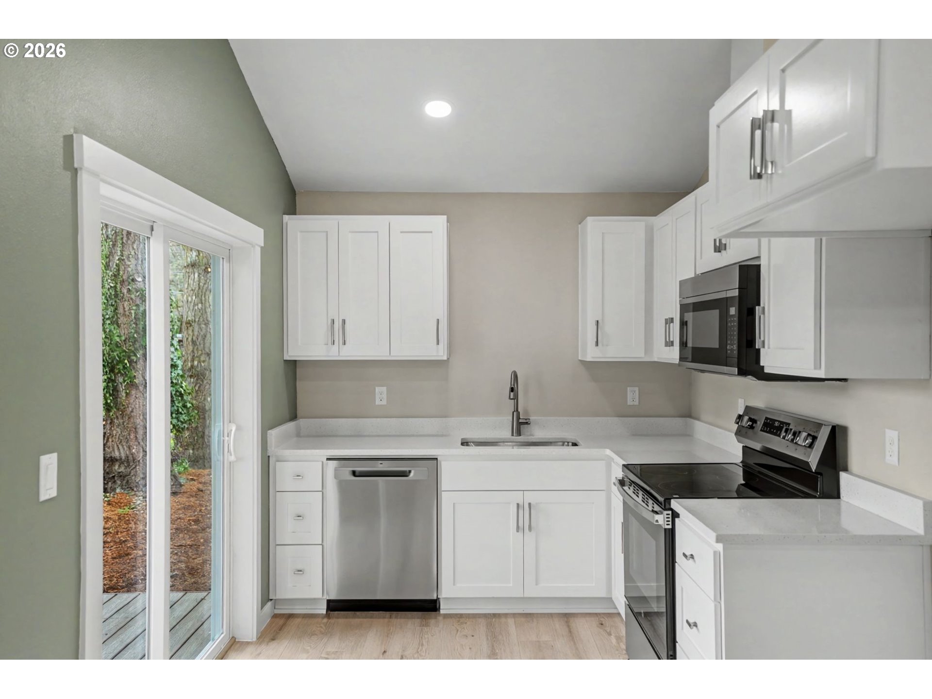 7425 5th Street Southeast Turner, OR 97392 - Photo 43 of 47 a kitchen with a sink window and cabinets