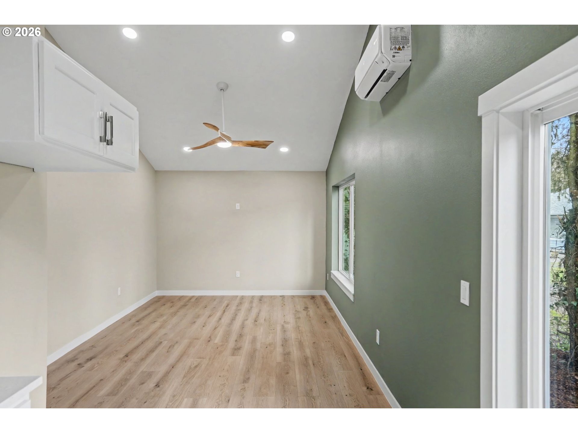 7425 5th Street Southeast Turner, OR 97392 - Photo 45 of 47 a view of an empty room with wooden floor