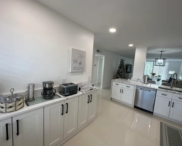 a kitchen with counter top space and cabinets