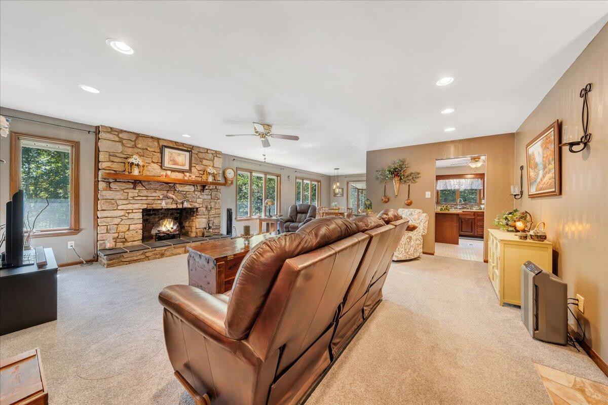 1605 Raspberry Branch Lane Montvale, VA 24122 - Photo 34 of 78 a living room with furniture a fireplace and a flat screen tv
