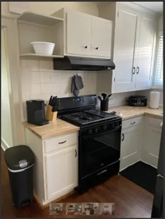 a kitchen with a stove and a microwave