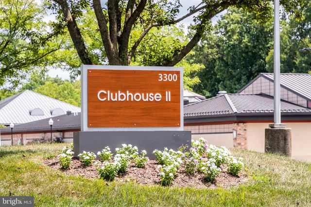 a sign that is in front of flowers