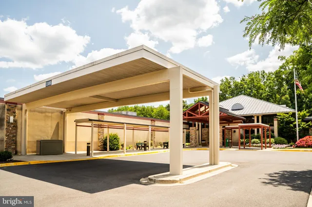 a view of a building with a floor to ceiling windows and a table
