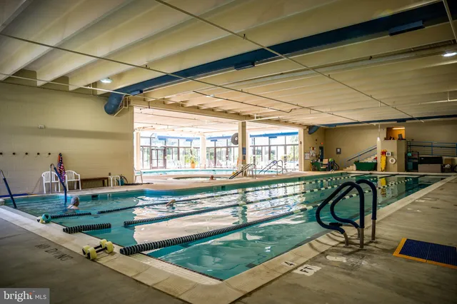 a sign that is in front of flowers