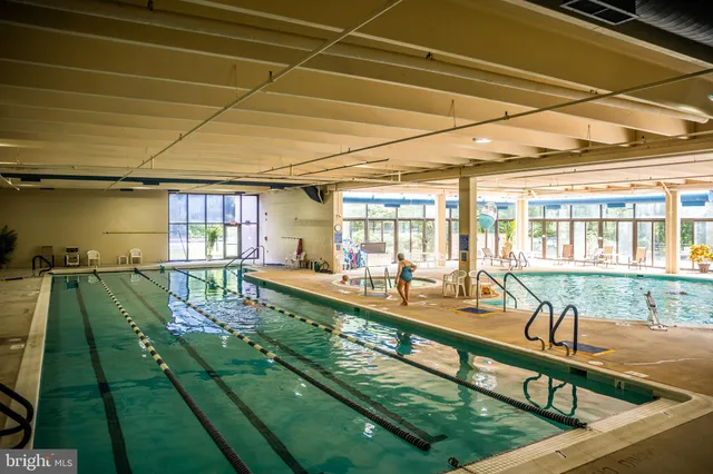 a view of swimming pool with outdoor seating