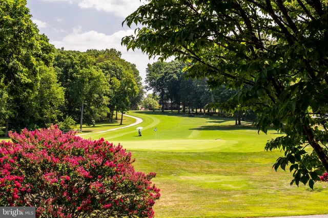 a view of a swimming pool with an outdoor space and seating area