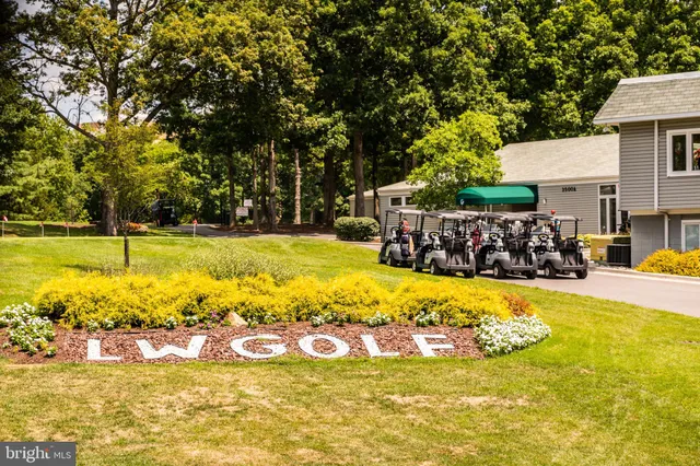 a view of a swimming pool with an outdoor space and seating area