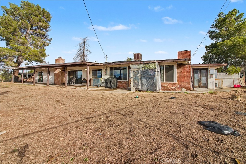 14798 Keota Road Apple Valley, CA 92307 - Photo 15 of 27 a view of a house with a yard