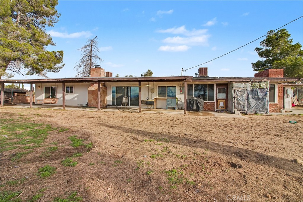 14798 Keota Road Apple Valley, CA 92307 - Photo 16 of 27 a front view of a house with a yard
