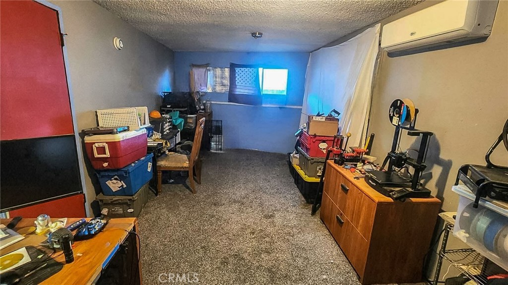 14798 Keota Road Apple Valley, CA 92307 - Photo 27 of 27 a view of a room with gym equipment