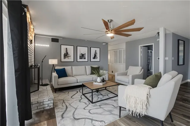 a living room with furniture and a large window