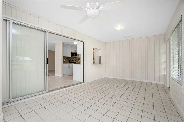a bathroom with a granite countertop sink toilet a mirror and shower