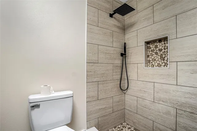 a bathroom with 2 sink and a mirror