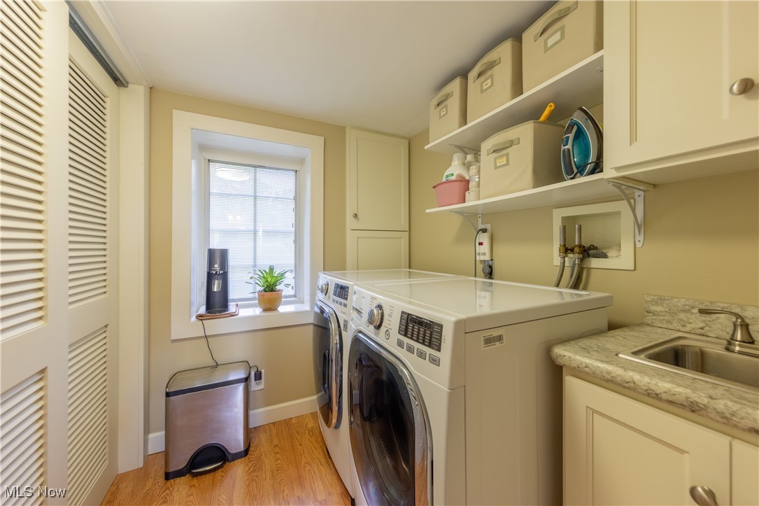 8405 Dines Road Novelty, OH 44072 - Photo 26 of 45 Storage closet and laundry room with electric dryer and laundry sink.