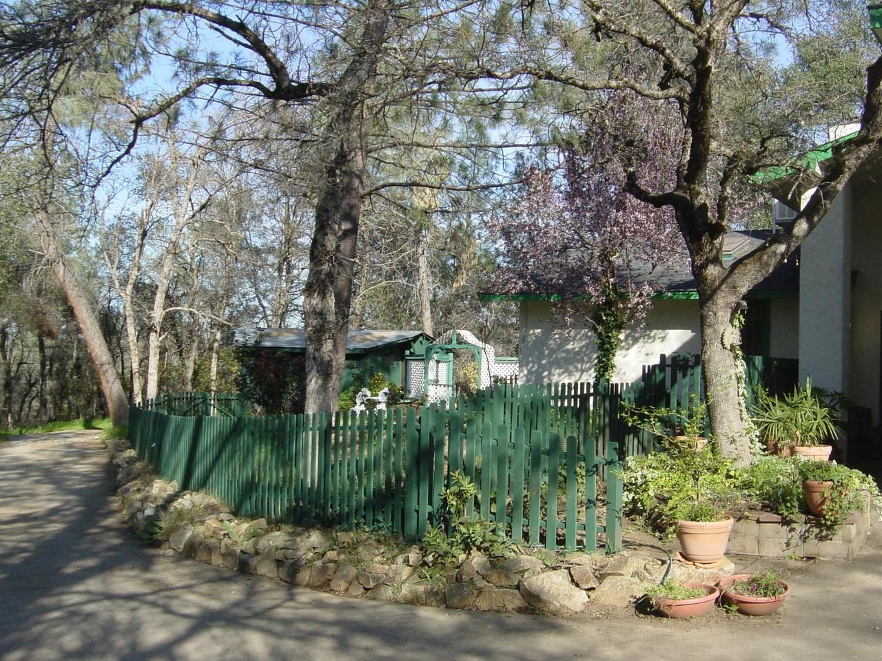 15916 Lower Springs Road Redding, CA 96001 - Photo 6 of 8 a backyard of a house with lots of green space