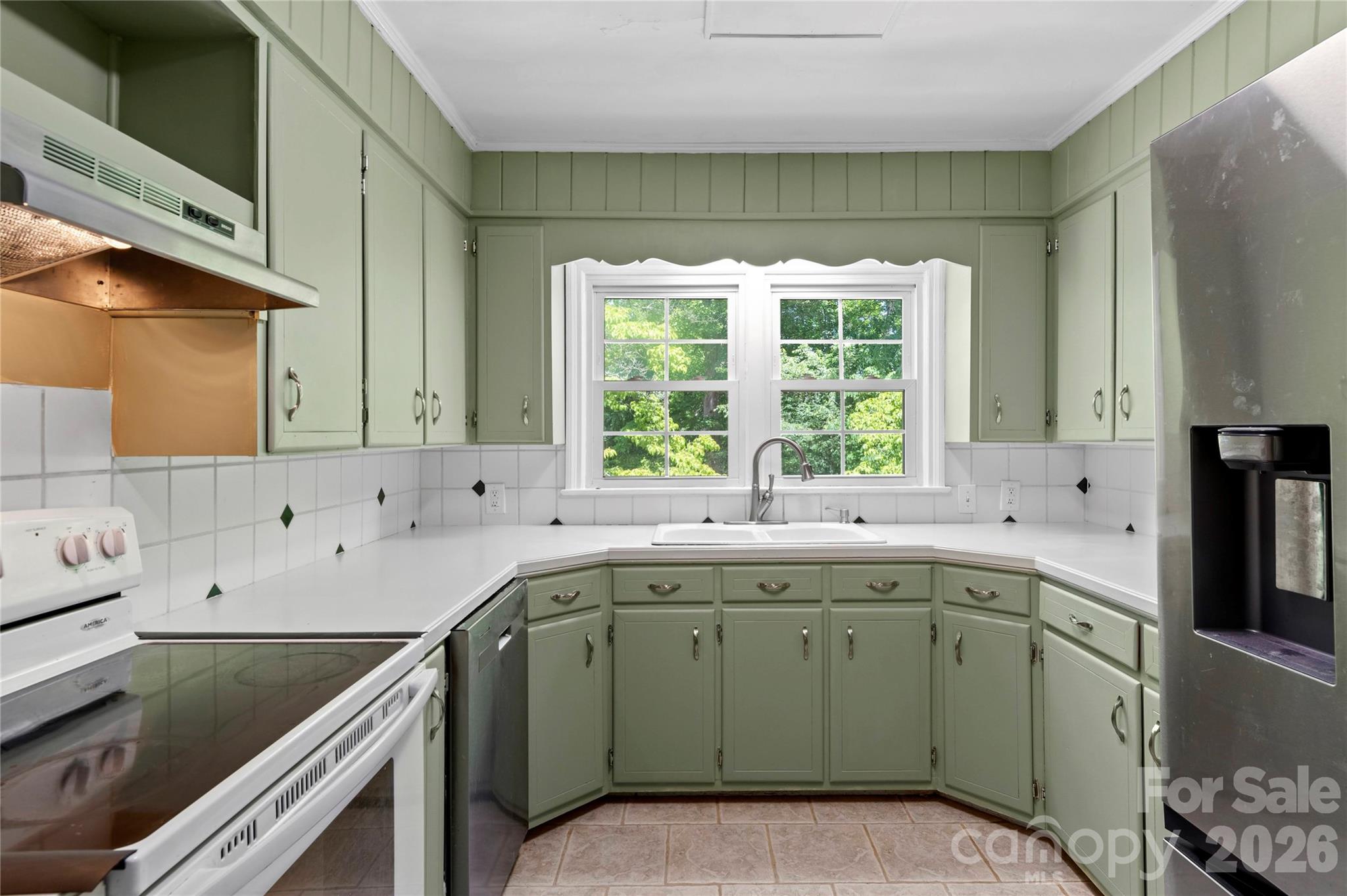 951 Dodson Mill Road Pilot Mountain, NC 27041 - Photo 13 of 48 a kitchen with a sink stove and cabinets