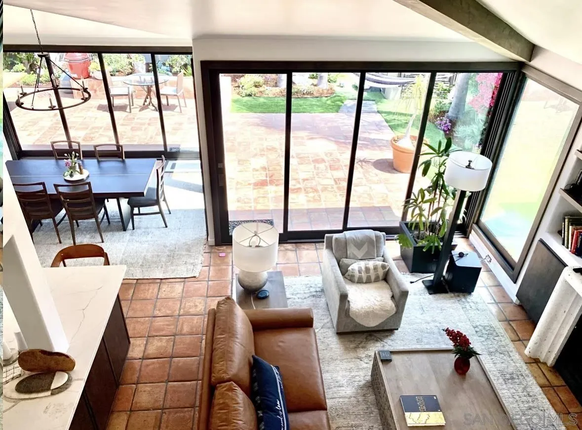 216 21st Street Del Mar, CA 92014 - Photo 11 of 31 a living room with furniture and a floor to ceiling window
