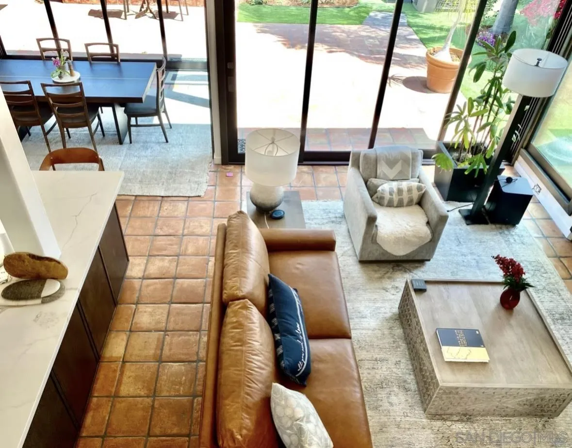 216 21st Street Del Mar, CA 92014 - Photo 12 of 31 a living room with furniture and a floor to ceiling window