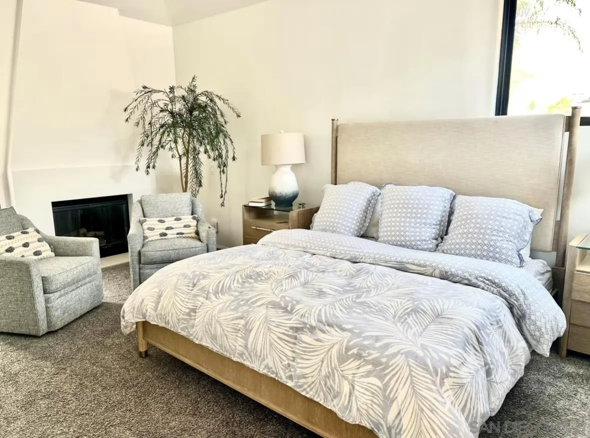 216 21st Street Del Mar, CA 92014 - Photo 18 of 31 a bedroom with a bed and a couch