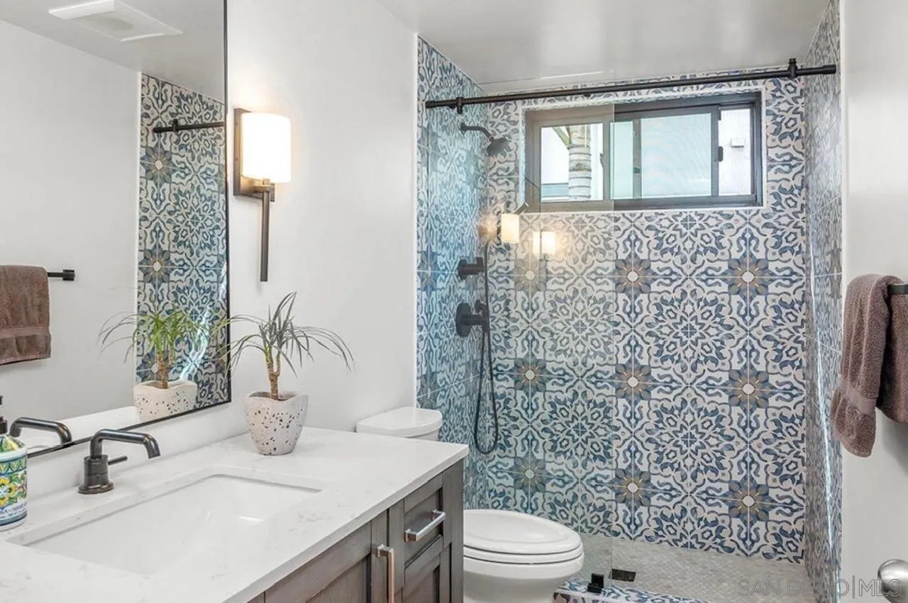 216 21st Street Del Mar, CA 92014 - Photo 19 of 31 a bathroom with a sink a toilet and shower