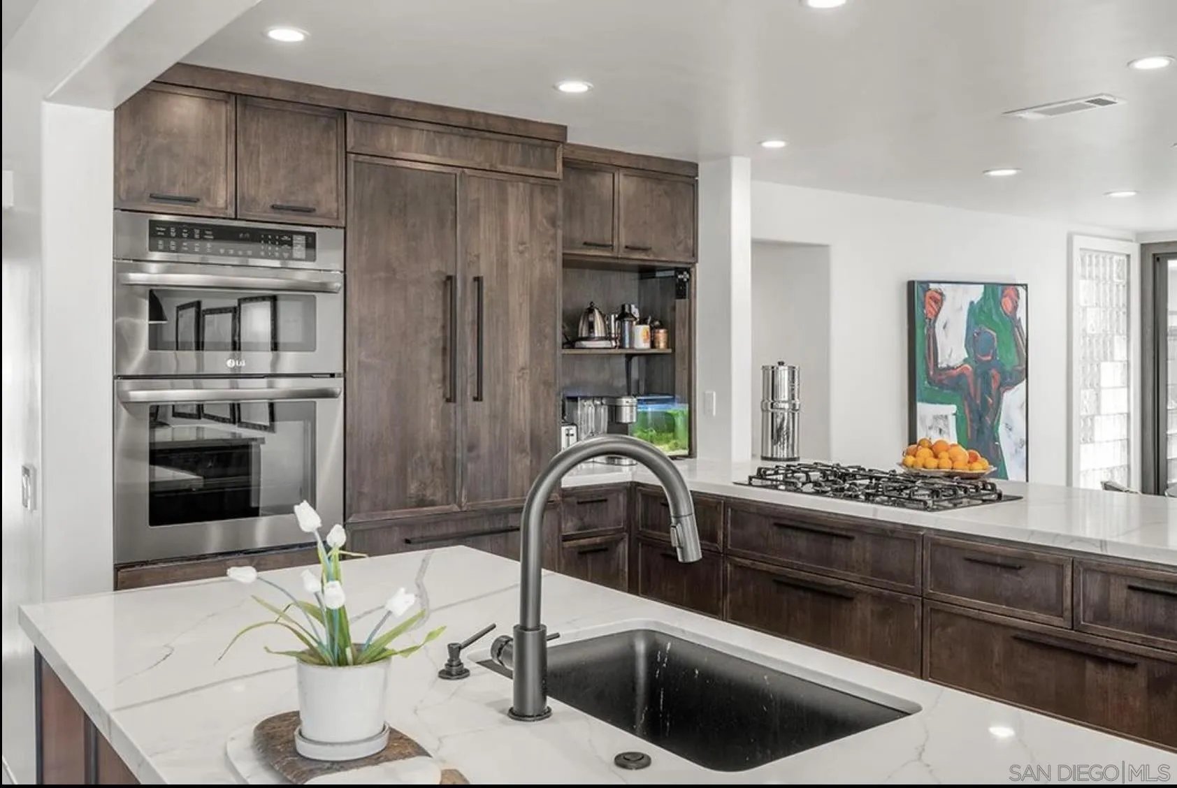 216 21st Street Del Mar, CA 92014 - Photo 2 of 31 a kitchen with stainless steel appliances granite countertop a refrigerator and a stove