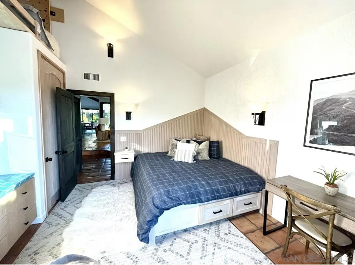 216 21st Street Del Mar, CA 92014 - Photo 24 of 31 a living room with a couch and dresser