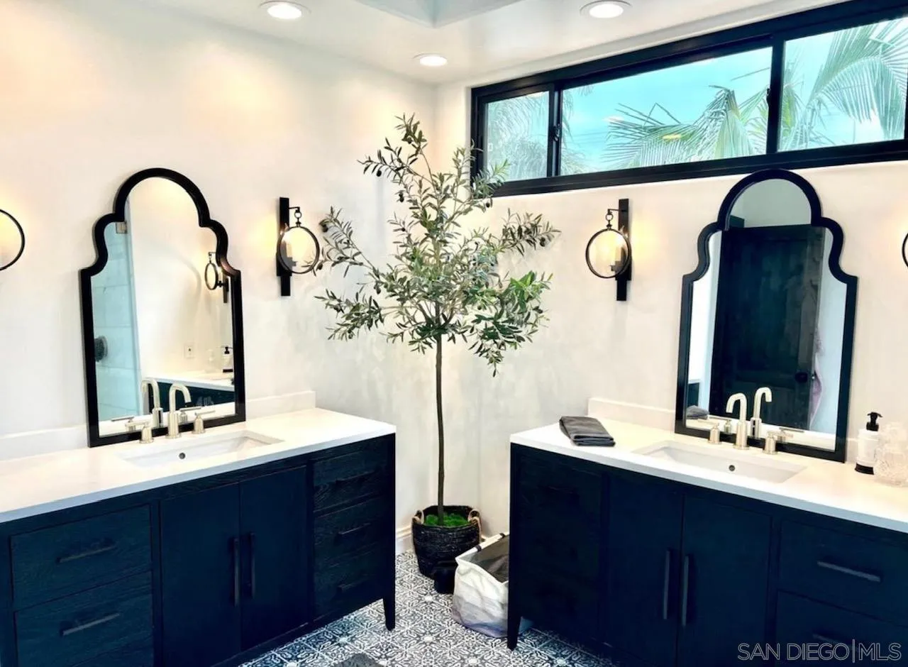 216 21st Street Del Mar, CA 92014 - Photo 6 of 31 a bathroom with a double vanity sink and a mirror