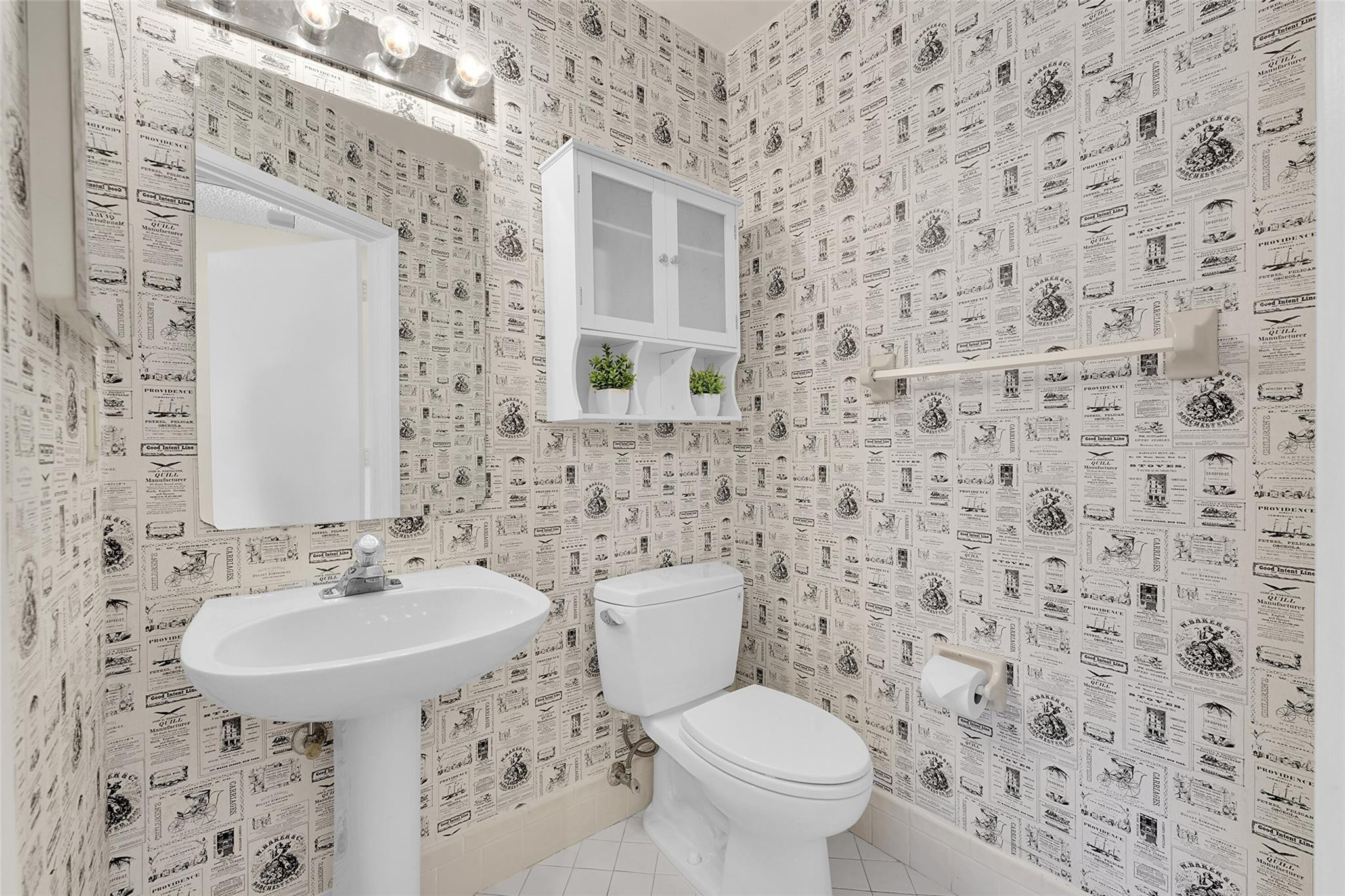 10761 Northwest 14th Street, Unit 281 Plantation, FL 33322 - Photo 11 of 33 a bathroom with a sink a toilet and mirror