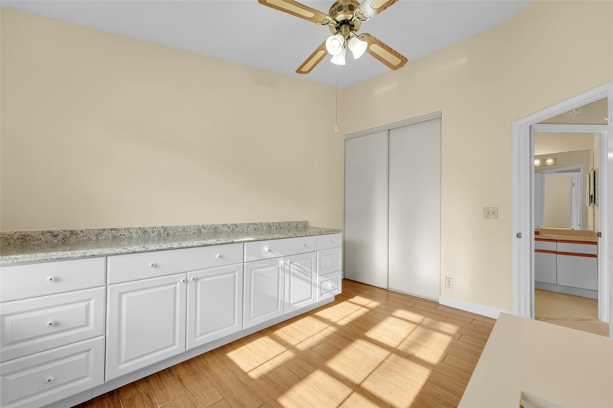 10761 Northwest 14th Street, Unit 281 Plantation, FL 33322 - Photo 13 of 33 a spacious bathroom with a granite countertop sink and a mirror