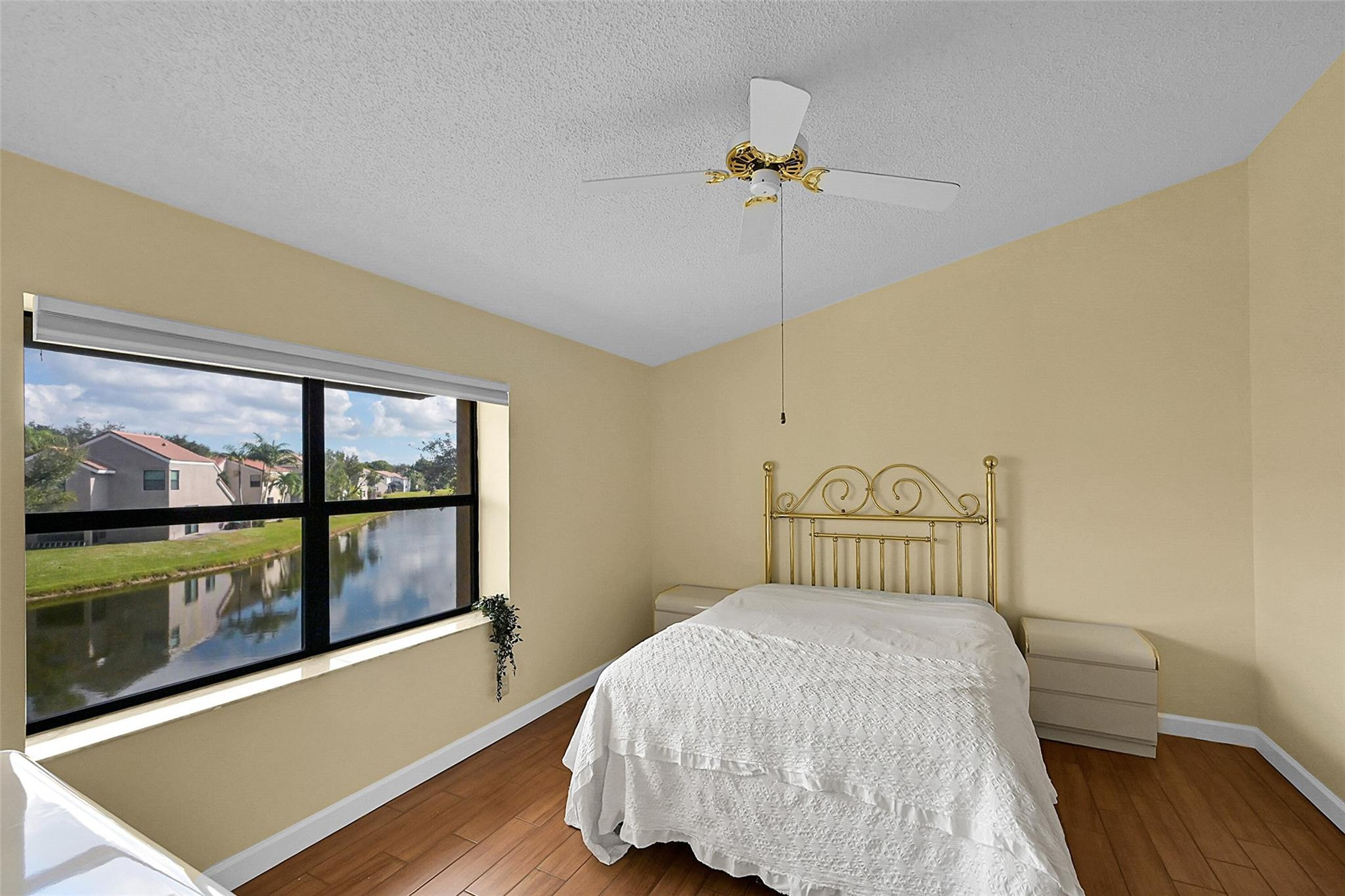 10761 Northwest 14th Street, Unit 281 Plantation, FL 33322 - Photo 19 of 33 a bedroom with a bed and window